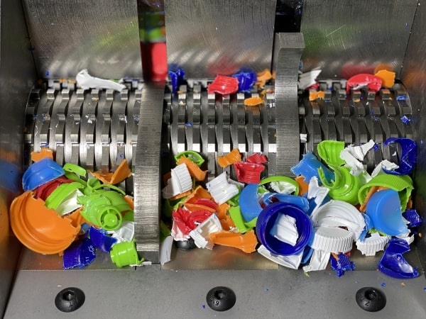 Bottle cap crushing chamber